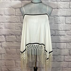 A. Peach boho retro hippie fringe hem tank top blouse